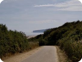 A path leading to the beach with cliffs in the distance at Brookwood Willerby, 36 bay view, Filey