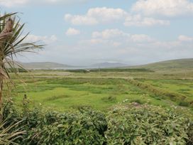 A view of green fields and hills at Wild Atlantic Way Country Cottage in Portmagee, County Kerry
