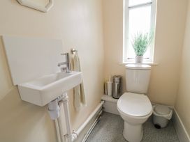 A bathroom with a toilet and sink at Old Higher Lighthouse Stopes Cottage Portland Bill