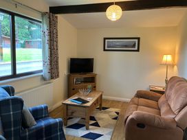A living room with a sofa and armchair at Primrose Lodge in Saltburn-by-the-Sea