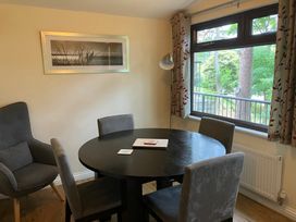 A dining room with a table and chairs at Primrose Lodge in Saltburn-by-the-Sea