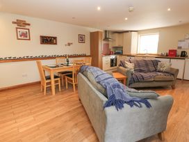 A living room with two sofas and a dining area at Cooper Cottage Potto near Stokesley
