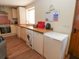 A kitchen with appliances and a sink at Cooper Cottage Potto near Stokesley