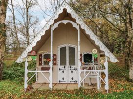 A small house with garden furniture outside at The Lodge in Old Buckenham near Attleborough