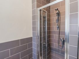 A shower enclosure with tiles at Hen Blas in Aberdaron