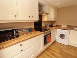 A kitchen with appliances on a countertop at The Old Bothy Bolton Low Houses near Wigton