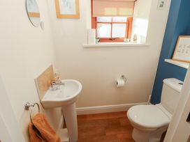 A bathroom with a sink and toilet at The Old Grainstore Bolton Low Houses near Wigton