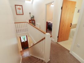 A staircase leading to different rooms at The Old Grainstore Bolton Low Houses near Wigton