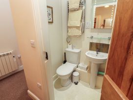 A bathroom with toilet and sink at The Old Grainstore in Bolton Low Houses near Wigton