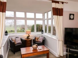 A snug with chairs and a table at Dilston House in Goathland