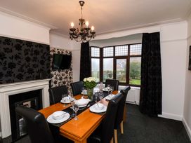 A dining room with a table set for dinner at Dilston House in Goathland