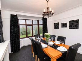 A dining room with a table set for a meal at Dilston House in Goathland