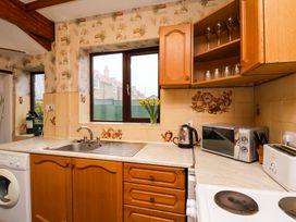 A kitchen with a sink and appliances at Dilston House in Goathland