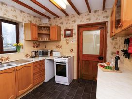 A kitchen with cabinets and appliances at Dilston House Goathland