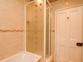 A bathroom with a shower and bathtub at Dilston House Goathland