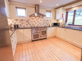 A kitchen with an oven and countertop at Ghyll Bank House Staveley near Windermere