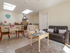 A kitchen with dining area and seating at Stable Cottage Cawton near Hovingham