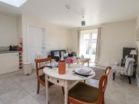 A dining room with a table and chairs at Stable Cottage in Cawton near Hovingham
