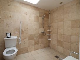 A bathroom with a shower and toilet at Stable Cottage in Cawton near Hovingham