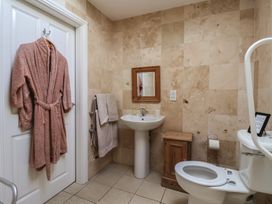 A bathroom with a sink and toilet at Stable Cottage in Cawton near Hovingham