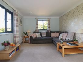 A living room with a sofa and table at The Station Flat St Newlyn East near Newquay