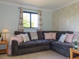 A living room with a sofa and side table at The Station Flat St Newlyn East near Newquay