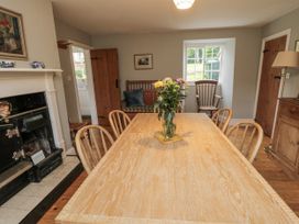 A dining room with a table and chairs at Brookleigh in Hutton-le-Hole