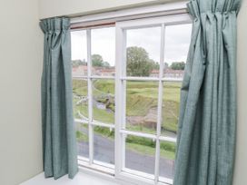 A window with curtains overlooking a landscape at Brookleigh in Hutton-le-Hole