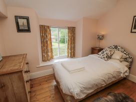 A bedroom with a bed and dresser at Brookleigh Hutton-le-Hole