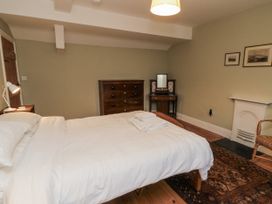 A bedroom with a bed and dresser at Brookleigh in Hutton-le-Hole