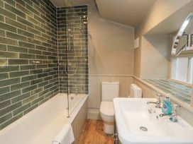 A bathroom with a bathtub, shower, sink, and toilet at Brookleigh in Hutton-le-Hole