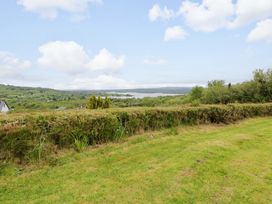 A view of a lake and landscape from a grassy area at Ballaghboy Cottage in Boyle, County Sligo