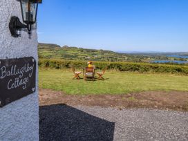 An outdoor seating area with a table and chairs at Ballaghboy Cottage Boyle, County Sligo