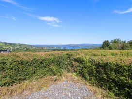 A view of a hedge and lake at Ballaghboy Cottage in Boyle, County Sligo