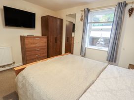A bedroom with a bed and furniture at Beach View near Benllech near Red Wharf Bay