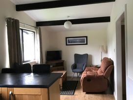 A living room with a sofa and television at Bluebell Lodge in Saltburn-by-the-Sea