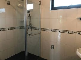 A bathroom with a shower and sink at Bluebell Lodge in Saltburn-by-the-Sea