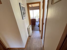A hallway with a heating unit and a picture frame at Suil Na Mara Aultbea