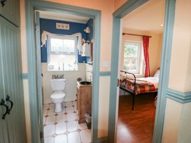 A bathroom with toilet and sink at Herons Cove Cottage Ballydehop
