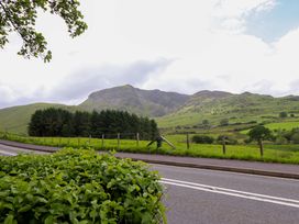A landscape with mountains and road at Stabal Cottage in Dolgellau