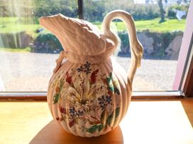 A decorative jug with floral design at Stone Cottage in Waterville, County Kerry