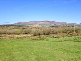 A landscape view of mountains and fields at Stone Cottage in Waterville, County Kerry