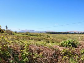 A scenic view of mountains and grassland at Stone Cottage Waterville, County Kerry