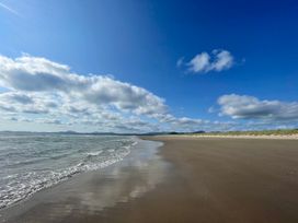 A beach with sand and water at Tafarn Trip, Tan Y Bwlch, Maentwrog
