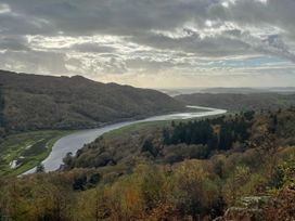 A view of a river winding through forests and hills at Tafarn Trip in Tan Y Bwlch, Maentwrog