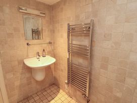 A bathroom with a sink and towel rail at Winster Fields Cartmel Fell near Windermere