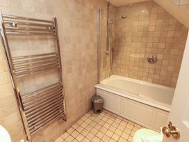 A bathroom featuring a bath tub and shower at Winster Fields, Cartmel Fell near Windermere