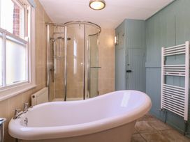 A bathroom with a bath tub and a shower at The Lock House in Gloucester
