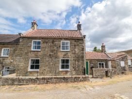 A house exterior with windows and a door at 1 Brow Cottages in Green End near Goathland