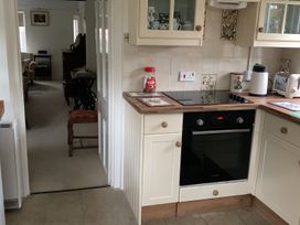 A kitchen with an oven and cabinets at 28 Oxborough